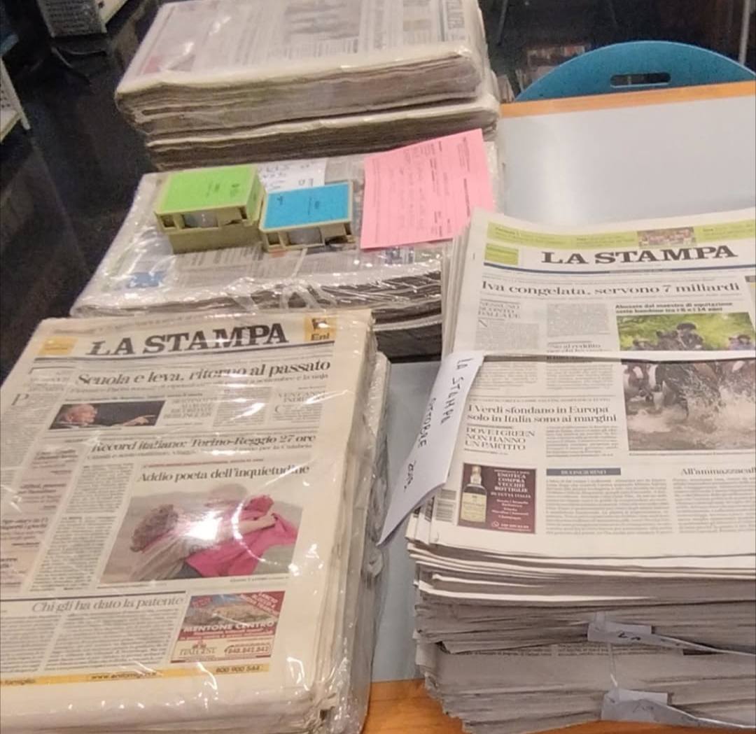 Research day in the library with stacks of newspapers and microfilm